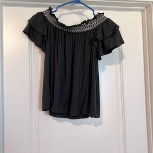 Gray, off the shoulder top with white detail.